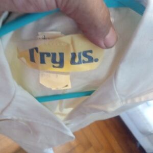 A 1980s jumpsuit with button up with draw string around waist